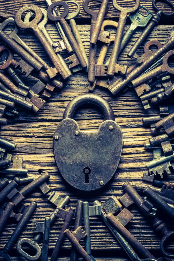 Old locks and keys on an old wooden table